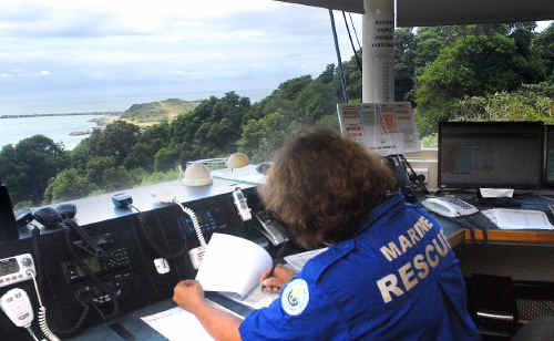 Operator Isabella Smietanski checks out the harbour from the Beacon Hill Marine Rescue base. Rapidly-growing trees are gradually obscuring the view. Operator Isabella Smietanski checks out the harbour from the Beacon Hill Marine Rescue base. Rapidly-growing trees are gradually obscuring the view.